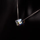 The Aurora Borealis Crystal Cube Necklace featuring a stunning Swarovski opalescent crystal cube on a delicate silver chain.