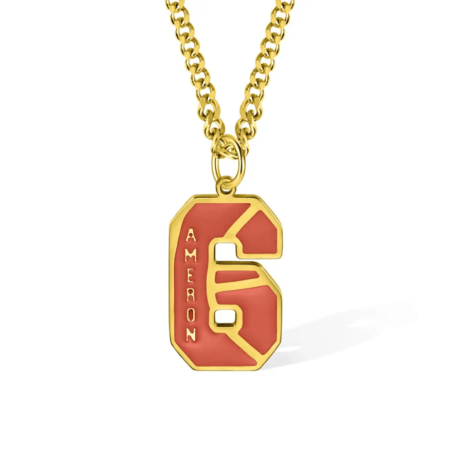 The pendant displays the letter "C" integrated into the shape of the number "6," making it less distinct. The name "Cameron" appears vertically, with the "C" formed by part of the number's design.