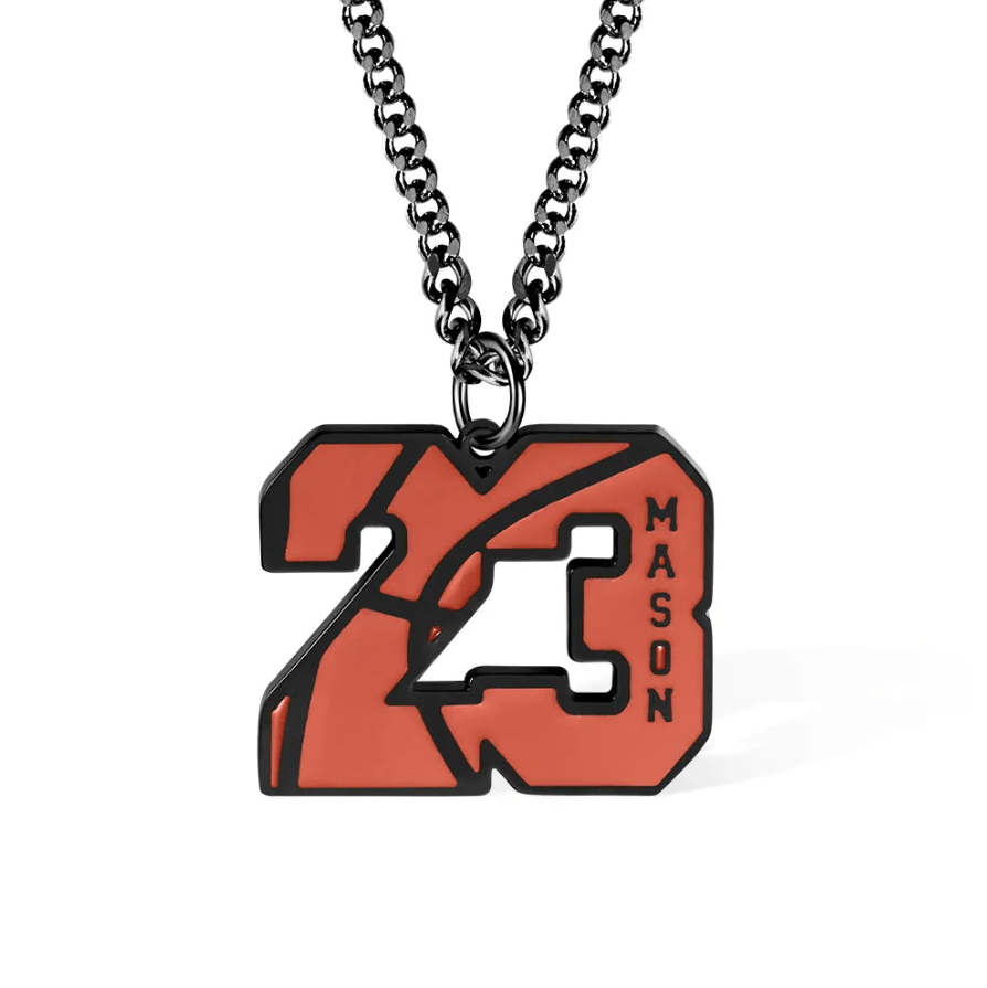 A basketball-themed pendant featuring the number "23" with the name "Mason" engraved on it, hanging on a black chain.