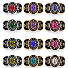 Twelve college rings with various colored gemstones, inscribed with "COLLEGE LOS ANGELES," "2023," and "GRACE" with Om symbols, in silver, gold, and rose gold variations.