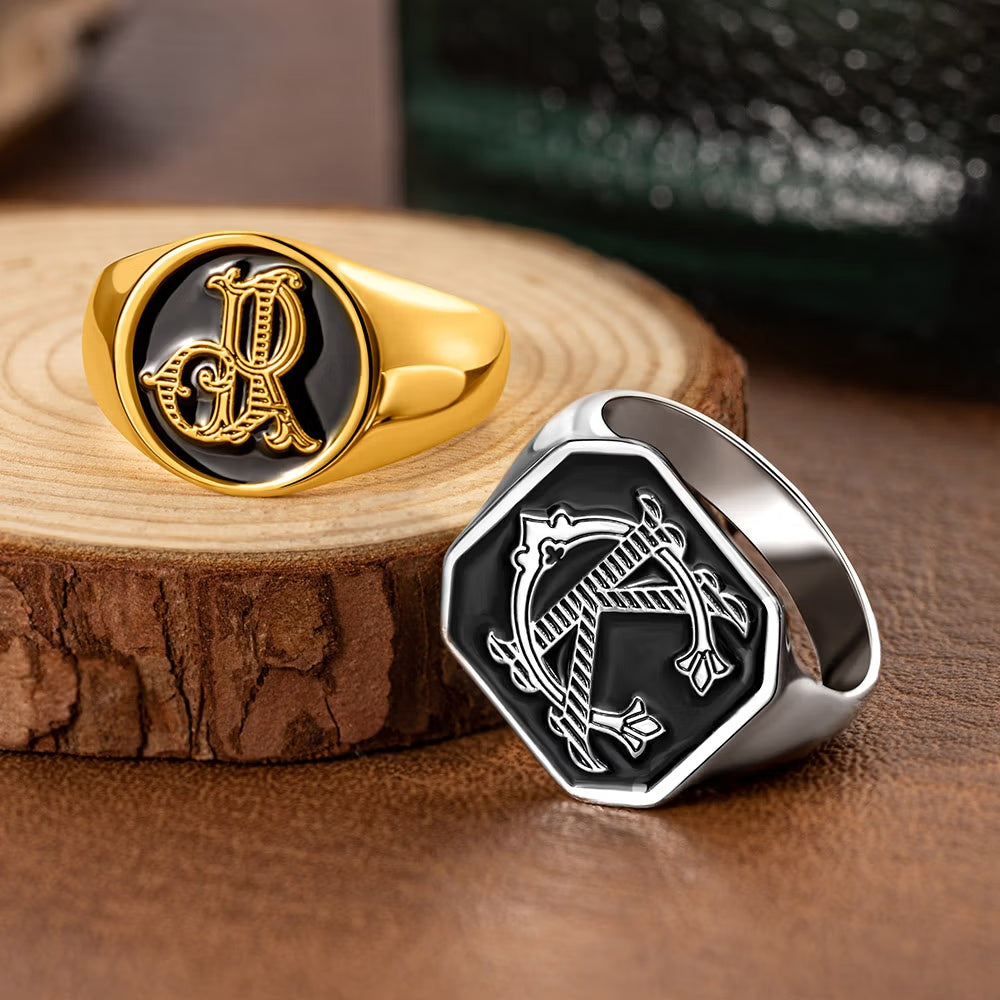 Gold and silver tone personalized double initials signet rings with black engraved monogram faces.