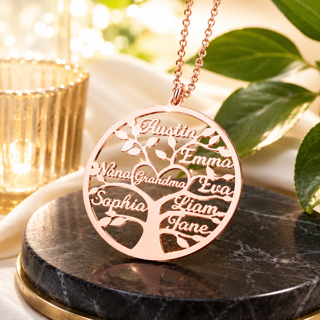 Rose gold personalized family tree necklace displayed on black marble