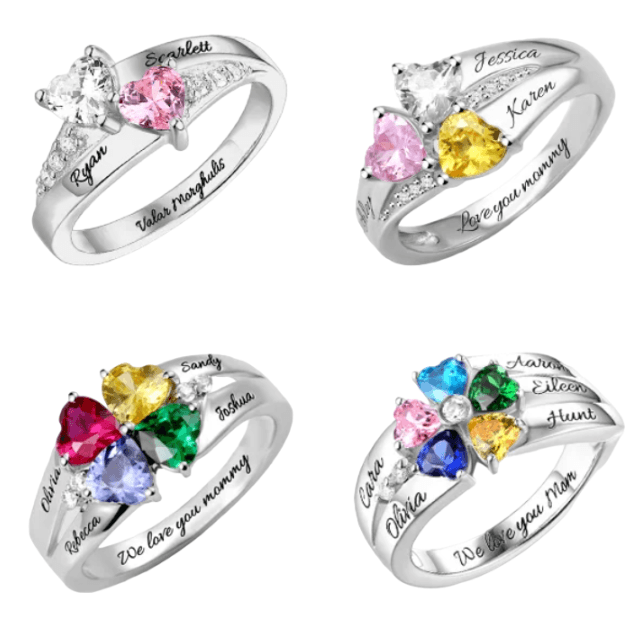 Four silver rings with heart-shaped gemstones in various colors, each personalized with names and inscriptions like "We love you mommy" and "Valor morghulis."