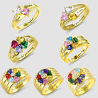 Seven gold rings with heart-shaped gemstones in various colors, each personalized with names and inscriptions like "We love you mommy" and "Valor morghulis."