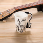 Personalised guitar handle ceramic mug with custom name and black guitar-shaped handle