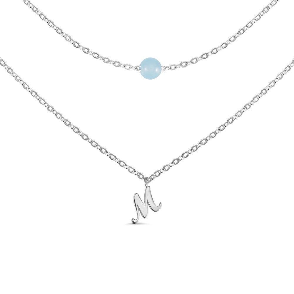 Custom Layered Initials and Tiny Moonstone Birthstone Necklace in silver with an 'M' initial charm and moonstone bead on delicate chains.