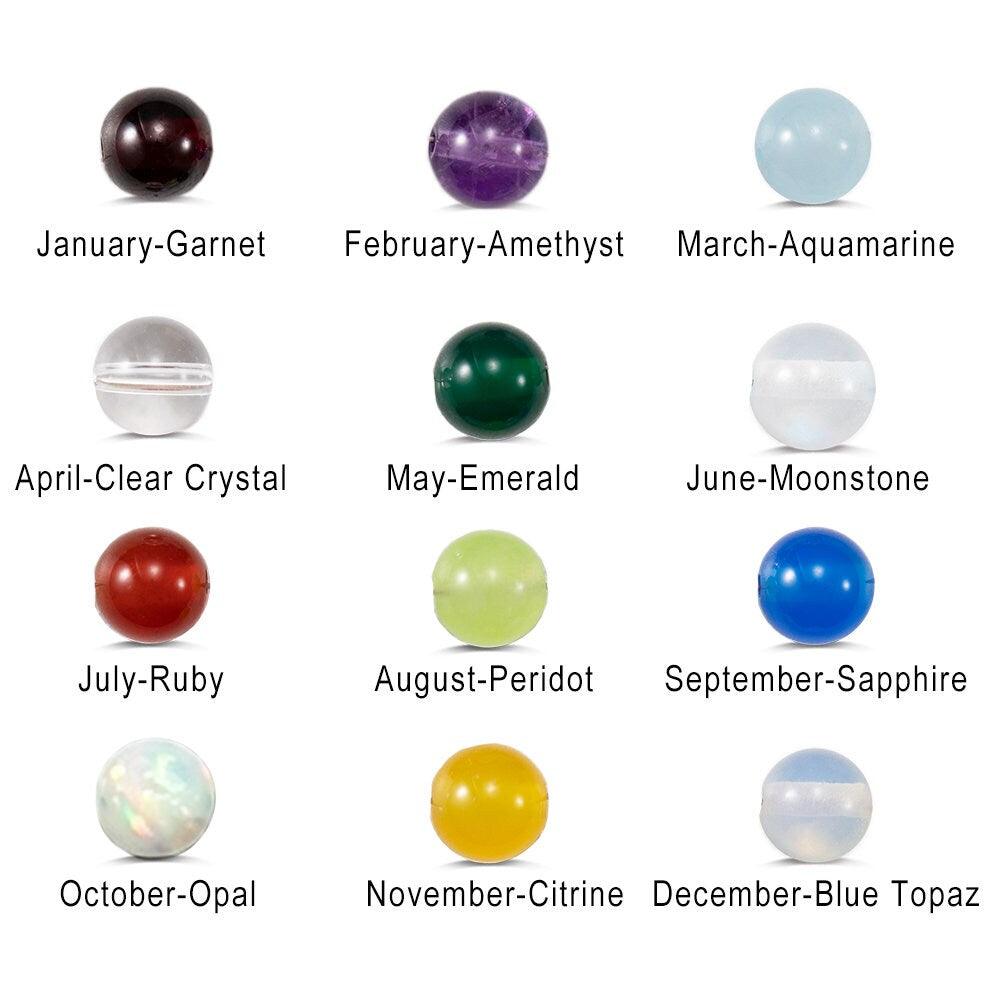 Birthstone chart showing gemstones for each month: January-Garnet, February-Amethyst, March-Aquamarine, April-Clear Crystal, May-Emerald, June-Moonstone, July-Ruby, August-Peridot, September-Sapphire, October-Opal, November-Citrine, December-Blue Topaz.