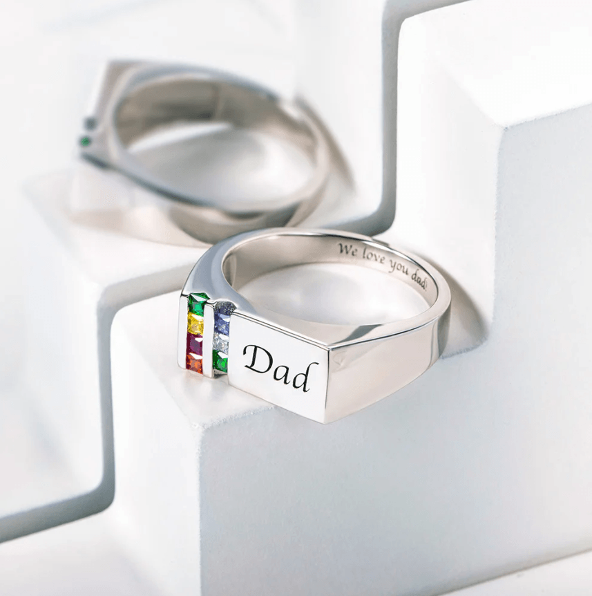 Custom silver 'Dad' ring with 'We love you dad' engraving and colorful birthstones.