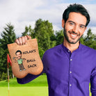 Man holding custom golf ball bag with personalized name and cartoon face
