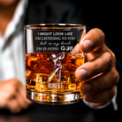 Custom golf whiskey glass with personalized name and golfer design held in hand