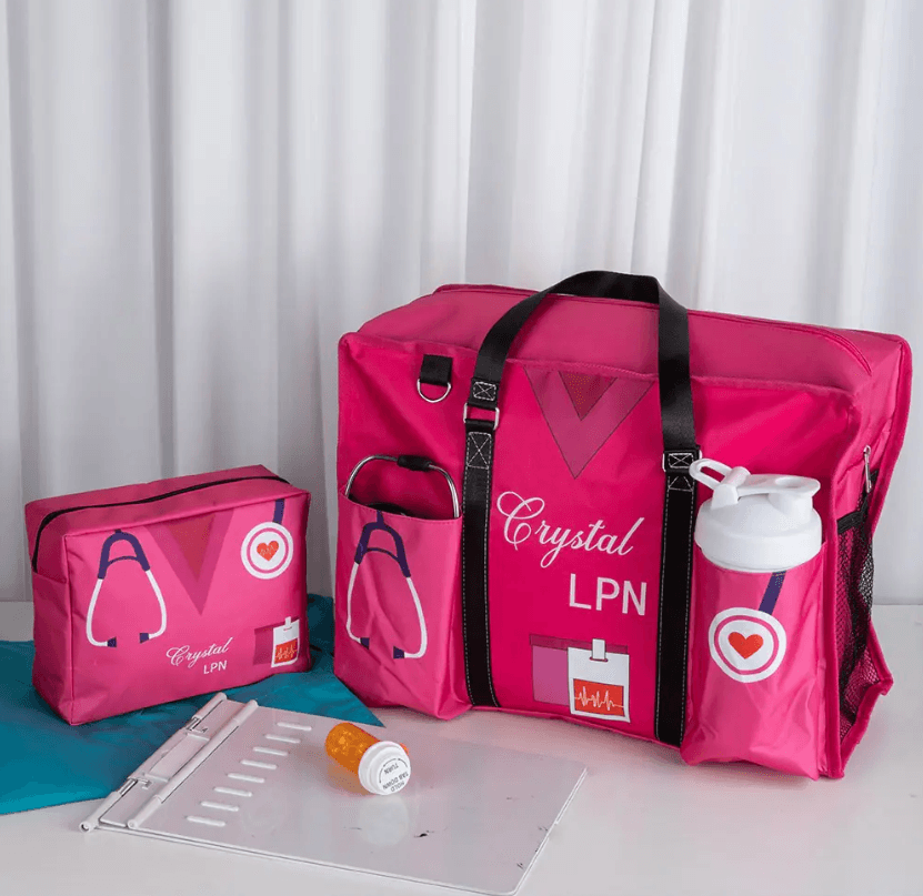 Personalized pink nurse tote bags, labeled 'Crystal LPN', with pockets and compartments for medical supplies.
