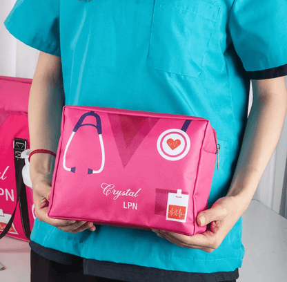 Nurse holding a personalized pink zippered pouch labeled 'Crystal LPN' with medical icons, ideal for healthcare professionals.