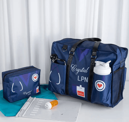 Navy blue nurse tote and accessory pouch set labeled 'Crystal LPN', equipped with medical tool slots and a bottle holder.