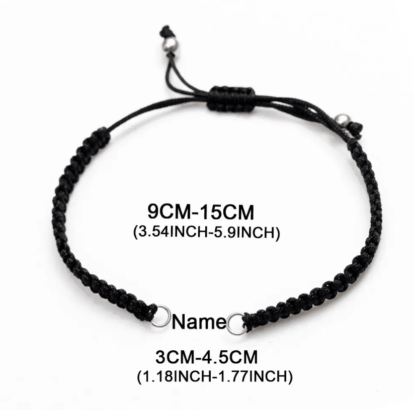 Black cord bracelet with adjustable length (9cm-15cm or 3.54inch-5.9inch) and space for a nameplate (3cm-4.5cm or 1.18inch-1.77inch). Silver ends.