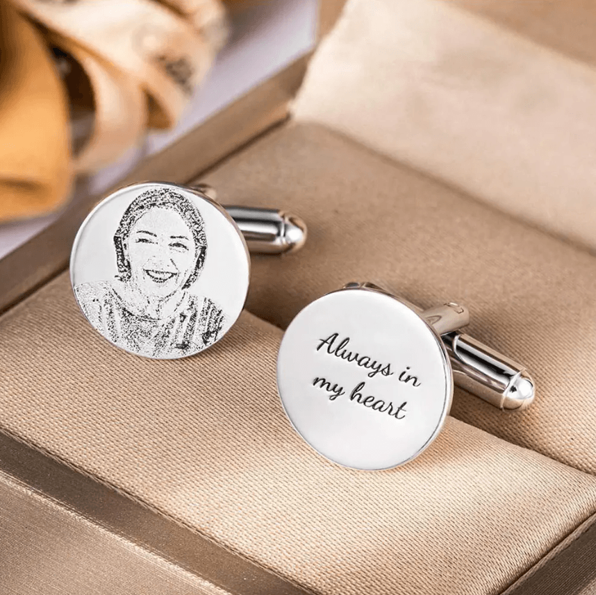 Silver cufflinks with a portrait of a smiling woman and 'Always in my heart' inscription.