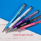 Five personalized pens in various colors (blue, white, purple, black, and pink) labeled "Wilson," "Emma," and "ALANA," with a note indicating to twist to open the pen.