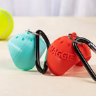 3D printed dog tennis ball holders in turquoise and red with carabiners