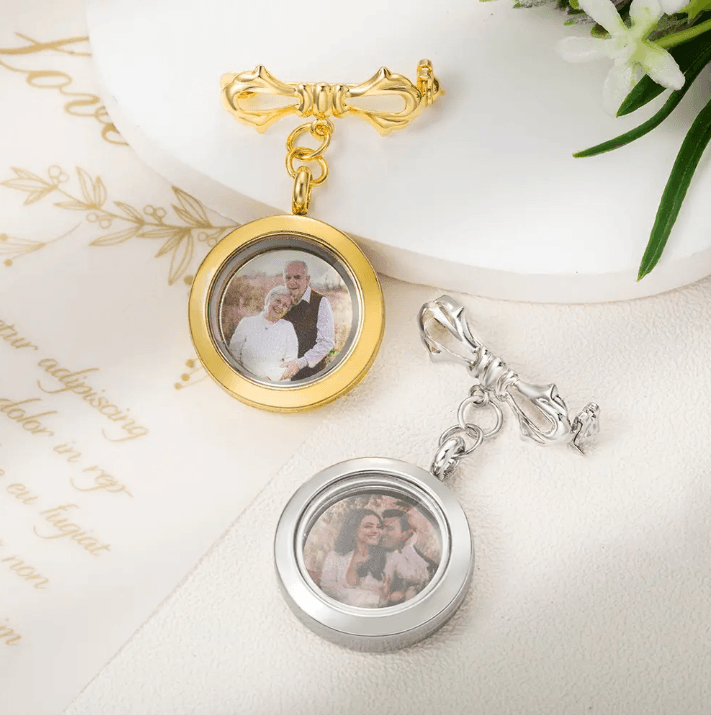Gold and silver lockets with couple photos on a decorated surface.