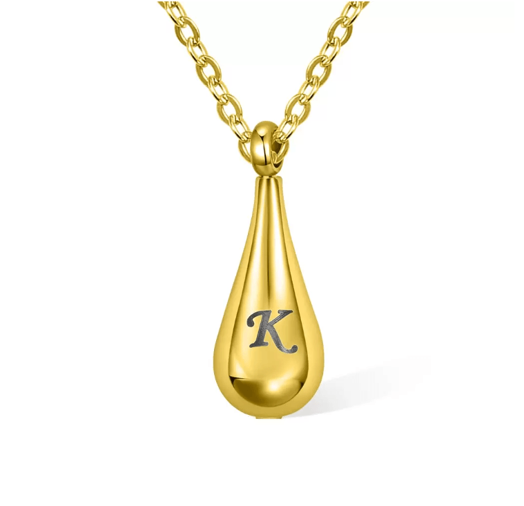 Gold teardrop pendant necklace with the letter "K" on a plain white background