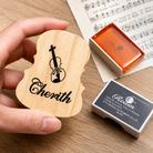 Custom wooden rosin box for violin, viola, cello, and bass featuring a personalized engraved lid and premium rosin.
