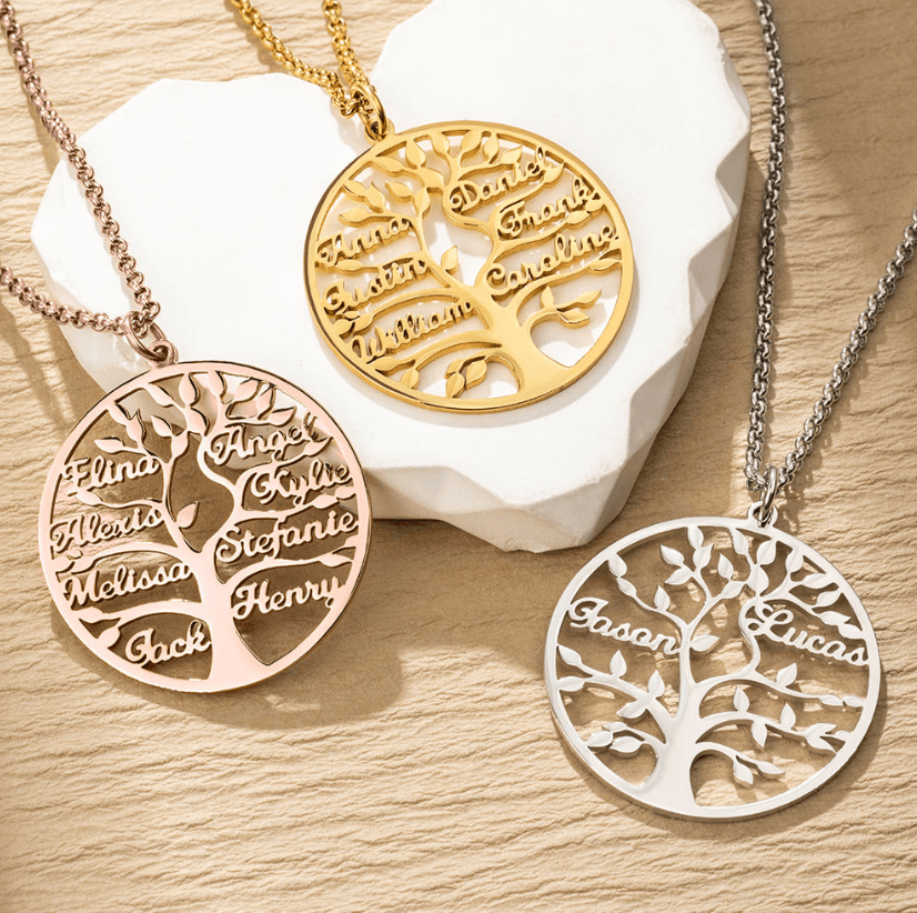 Three circular pendants with family tree designs, displaying names like Anna, William, Elina, and Jason, in gold, rose gold, and silver on chains.