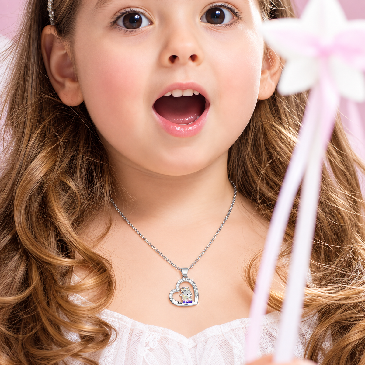 Girl wearing a personalized crowned unicorn heart necklace