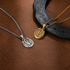 Gold and silver horse hoof necklaces displayed with western horseshoe