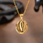 Gold horse hoof and horseshoe pendant necklace close-up