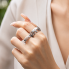 Two handcrafted custom name rings in genuine 925 sterling silver on model
