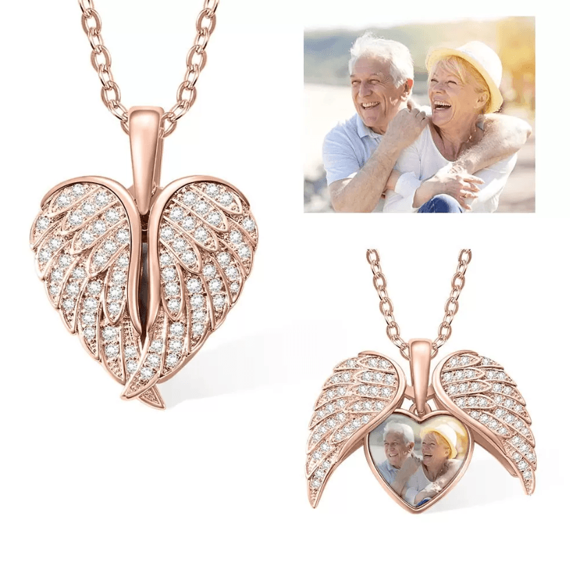 Rose gold angel wing locket necklace with sparkling crystals and photo insert of an elderly couple.