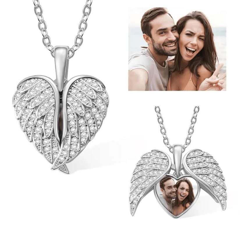 Silver angel wings locket necklace with encrusted crystals and customizable photo pendant.