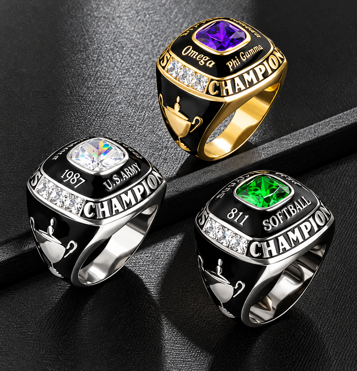 Three personalized champion rings in gold and silver with purple, clear, and green stones, custom engraving, black enamel, and trophy details.