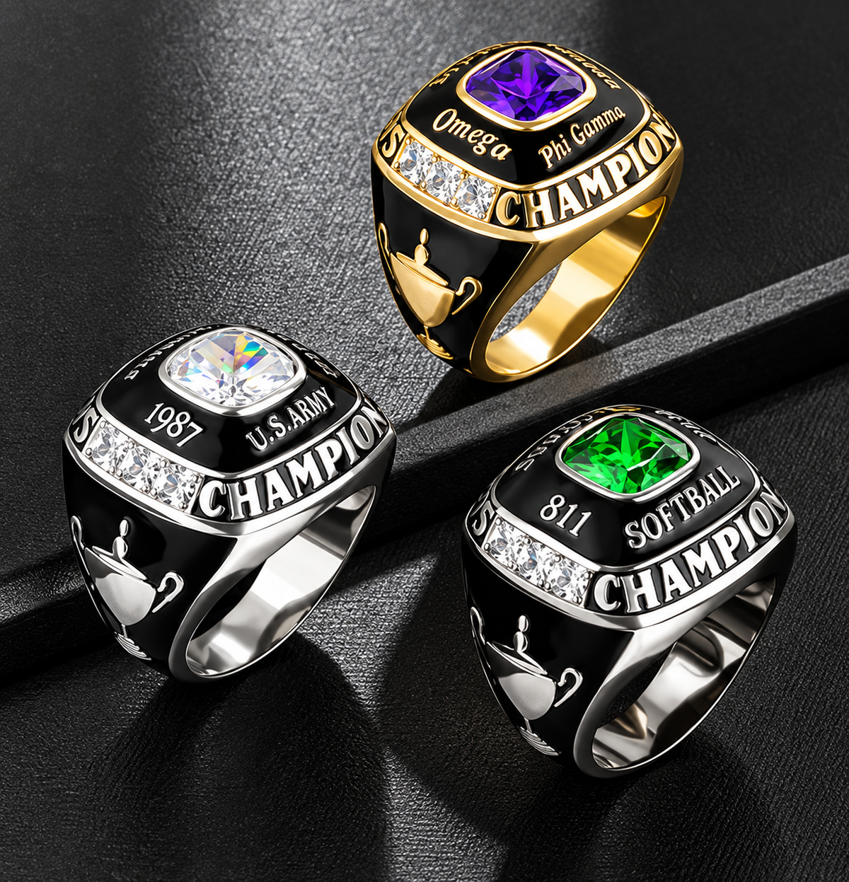 Three personalized champion rings in gold and silver with purple, clear, and green stones, custom engraving, black enamel, and trophy details.