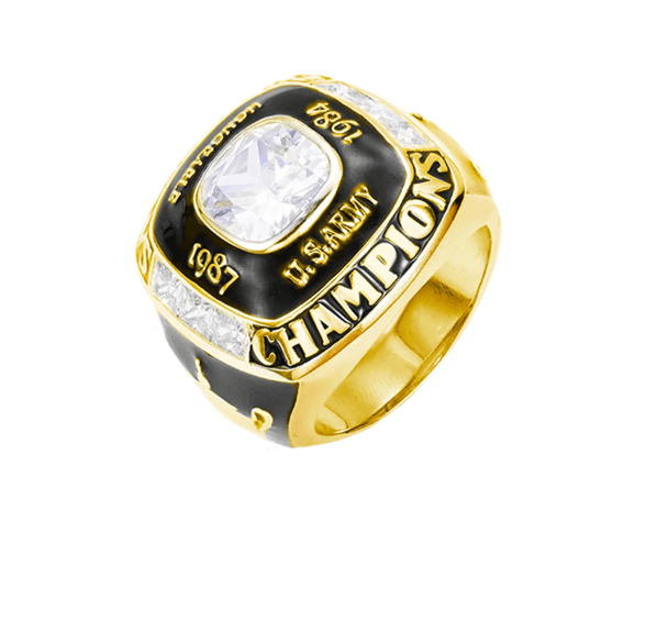 Gold and black championship ring with a central diamond, engraved '1987 U.S. Army Champions', flanked by smaller diamonds.