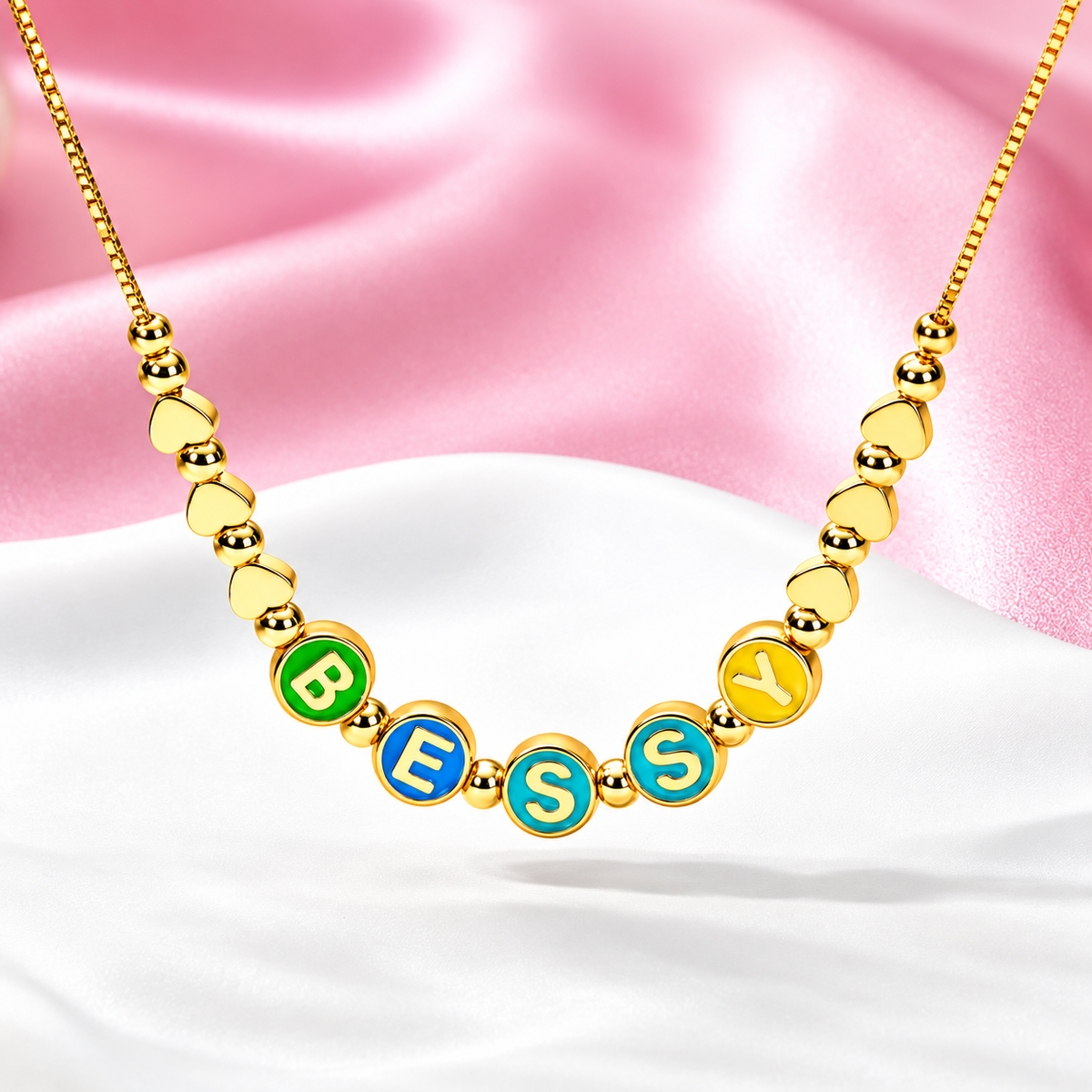 Personalized enamel letter necklace with colorful name beads and gold heart charms