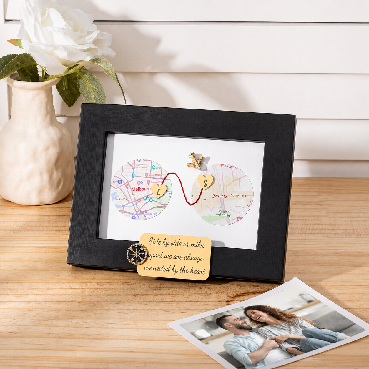 Personalized map gift for couples displayed with flowers and photo prints