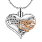 A heart-shaped pendant with the inscription "A piece of my heart lives in heaven," featuring a gold ribbon with the word "Nana."