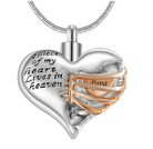 A heart-shaped pendant with the inscription "A piece of my heart lives in heaven," featuring a gold ribbon with the word "Papa."