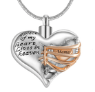 A heart-shaped pendant with the inscription "A piece of my heart lives in heaven," featuring a gold ribbon with the word "Mama."