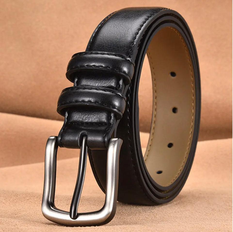 Coiled black leather belt with meticulous stitching and a polished metal buckle, showcasing durability and elegance.