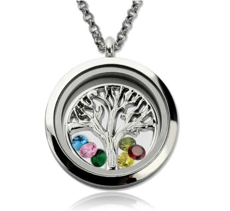A silver tree of life pendant with six colorful gemstones (blue, pink, green, yellow, red, and light green) set in a circular frame on a silver chain necklace.