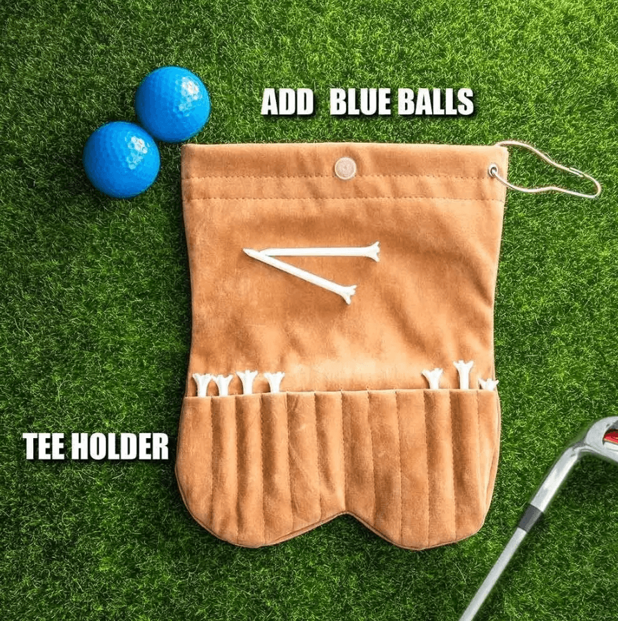 Golf ball sack with compartments for tees, displayed open on grass. Includes blue golf balls and white tees, with labels indicating "Add Blue Balls" and "Tee Holder