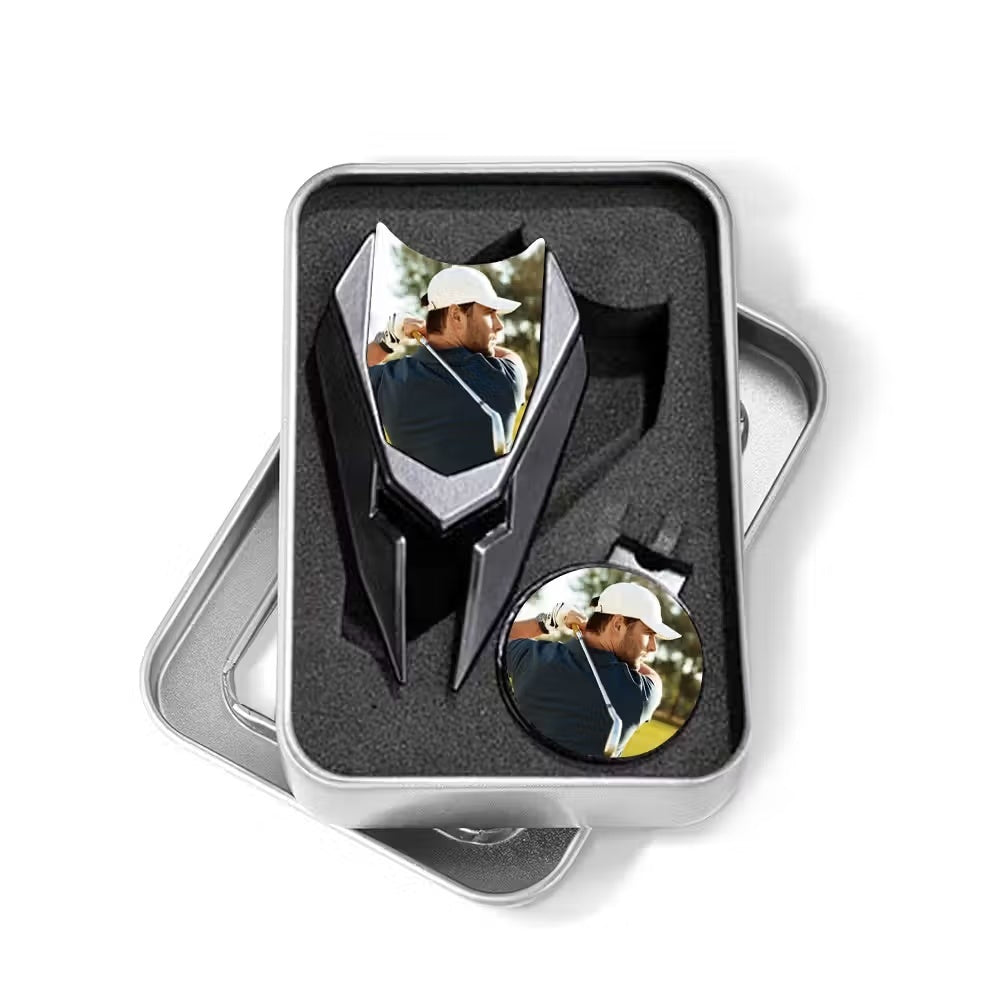 Personalized photo golf divot tool and magnetic ball marker set in metal case on white background