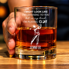 Personalized golf glass with engraved golfer design and custom name held in hand