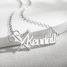 Silver personalized hairdresser necklace with the name Kendall, featuring a scissors and comb design, displayed on a white background.