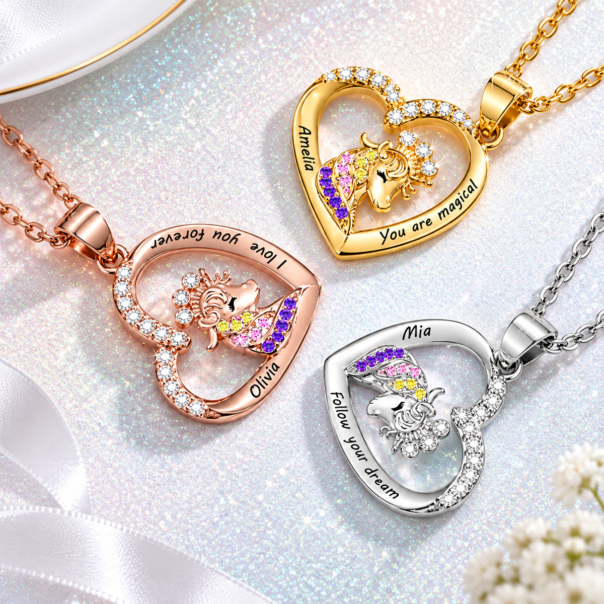 Gold, rose gold and silver crowned unicorn necklaces with tilted heart pendants