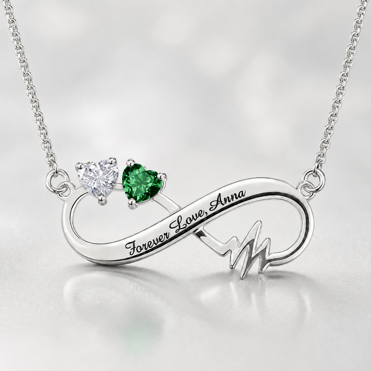 Personalized infinity birthstone necklace with clear and green stones