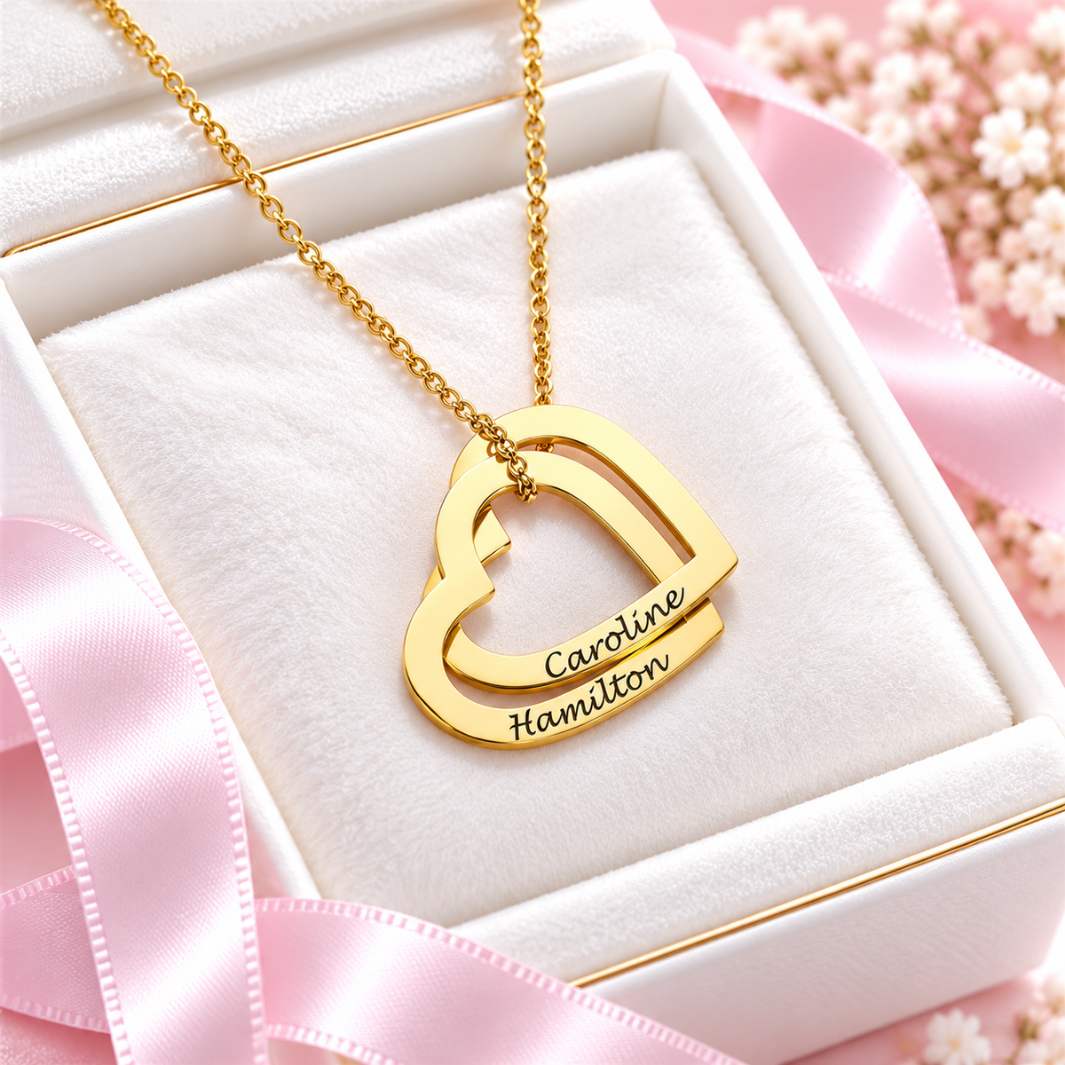 Personalized gold interlocking hearts necklace with two engraved names