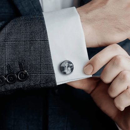 Man adjusting cuff with personalized silver cufflink featuring a black and white photo of a woman.