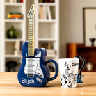 Personalised guitar-shaped ceramic mug with removable lid alongside personalised guitar handle coffee mug